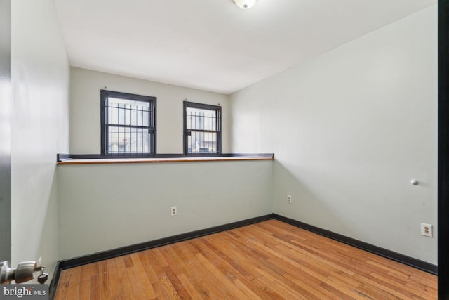 spare room featuring hardwood / wood-style flooring