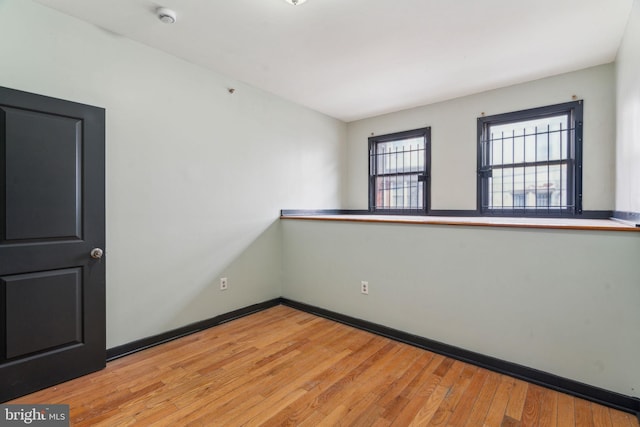 unfurnished room featuring light hardwood / wood-style flooring