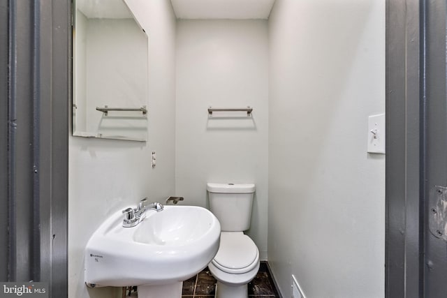 bathroom featuring sink and toilet