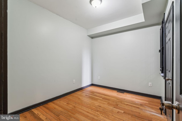 spare room featuring light hardwood / wood-style floors