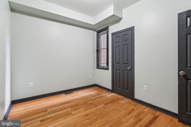 spare room with light wood-type flooring