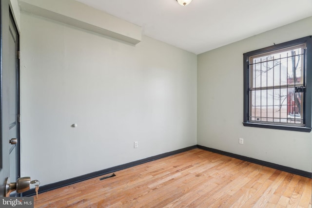 empty room with wood-type flooring