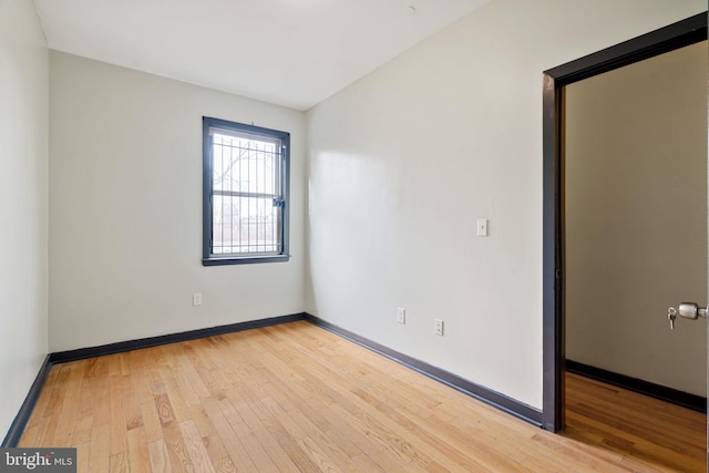 empty room with light hardwood / wood-style floors