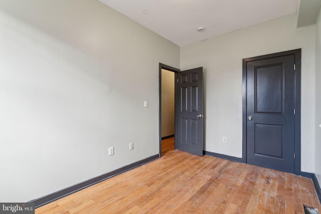 unfurnished bedroom featuring light hardwood / wood-style floors