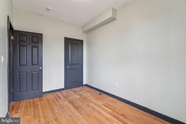 unfurnished bedroom featuring wood-type flooring