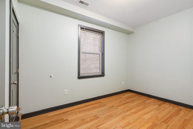 spare room featuring light hardwood / wood-style flooring