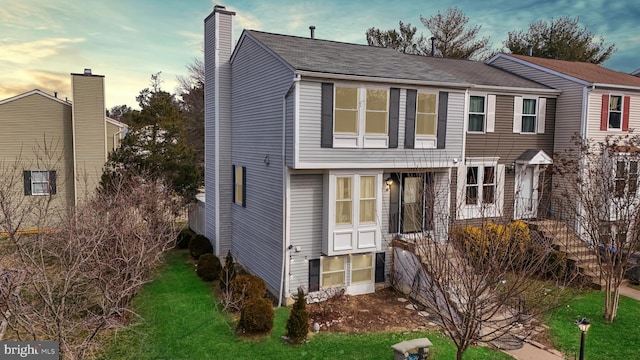 view of front of house with a yard