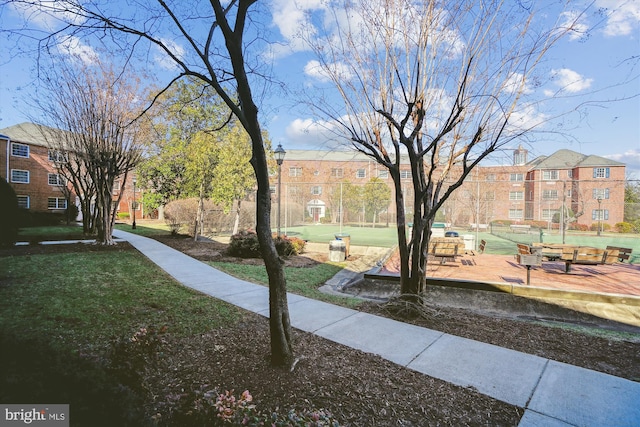 view of property's community with a lawn