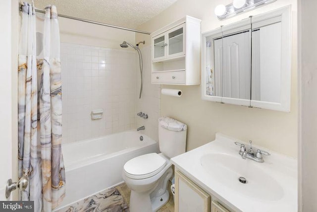 full bath featuring toilet, shower / tub combo, a textured ceiling, and vanity