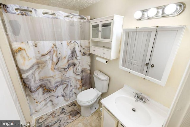 full bath with toilet, a textured ceiling, and vanity