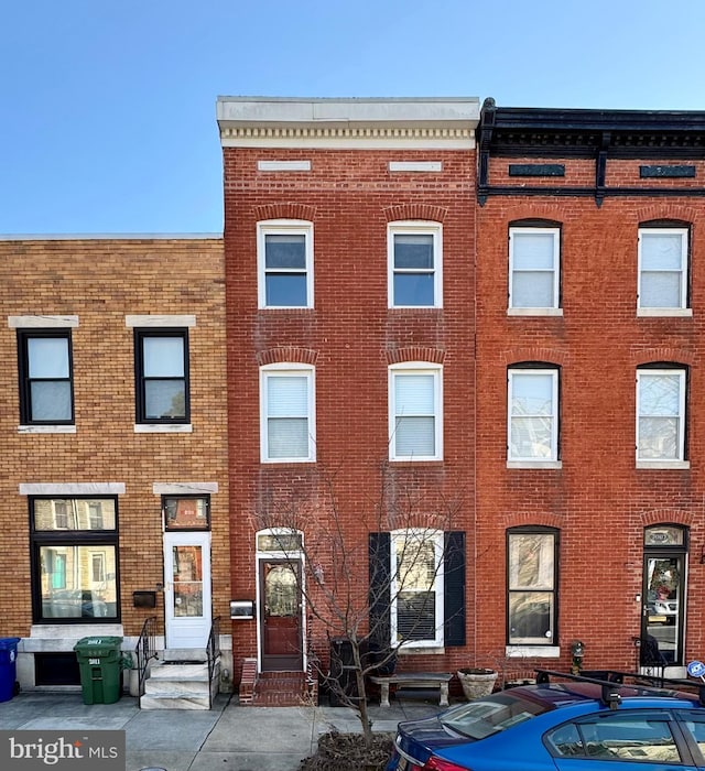 view of front of home featuring brick siding and entry steps