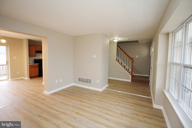 unfurnished room featuring light hardwood / wood-style floors