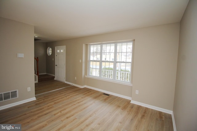 unfurnished room featuring light hardwood / wood-style floors