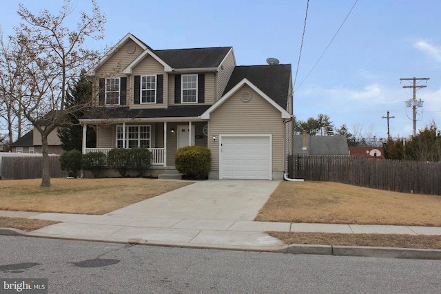 view of front of home with a porch, a garage, and a front lawn