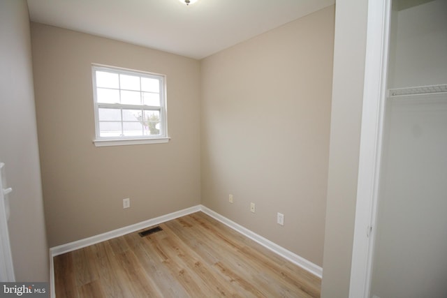 empty room with light wood-type flooring