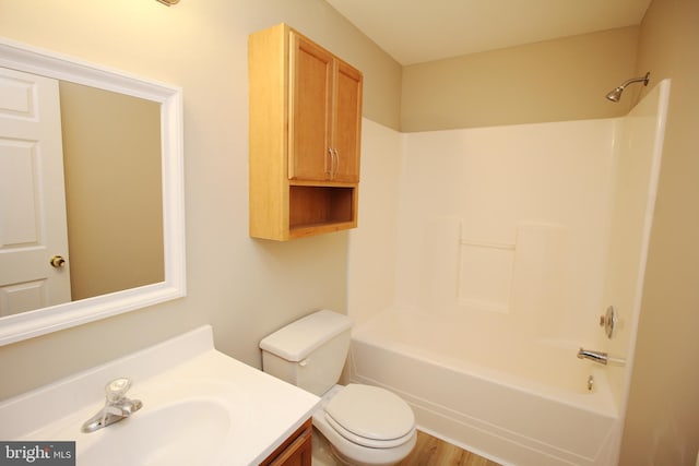 full bathroom with vanity, washtub / shower combination, and toilet