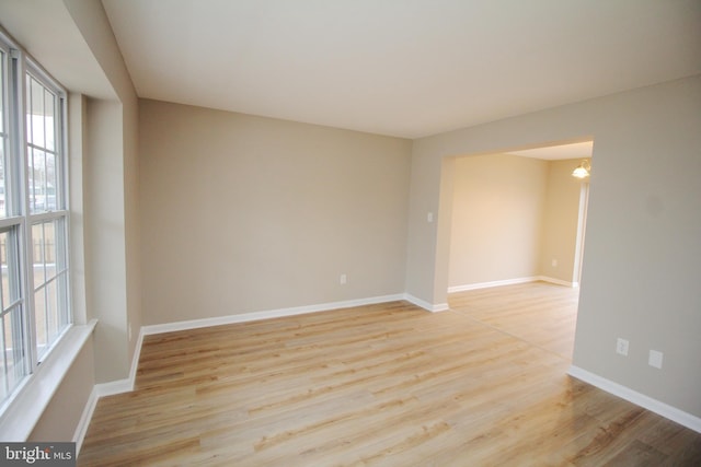 spare room with light wood-type flooring