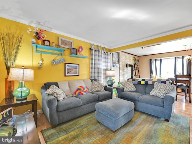 living room with hardwood / wood-style flooring and crown molding