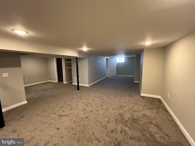 basement with dark colored carpet