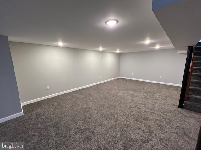 basement with dark carpet