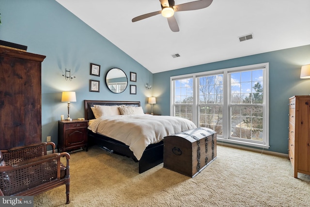 bedroom with visible vents, vaulted ceiling, light carpet, and ceiling fan