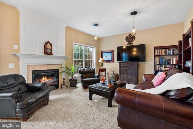 living room with carpet flooring and a glass covered fireplace