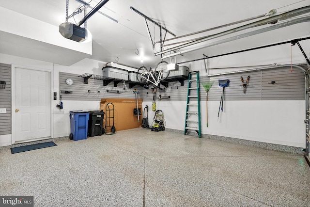 garage featuring baseboards and a garage door opener