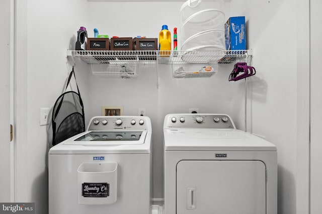 washroom featuring laundry area and separate washer and dryer