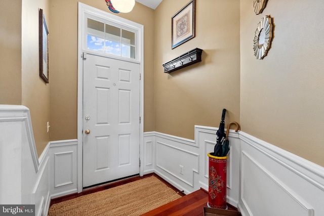 foyer featuring a wainscoted wall