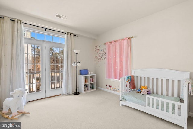 carpeted bedroom featuring access to exterior