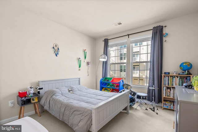 bedroom with light colored carpet