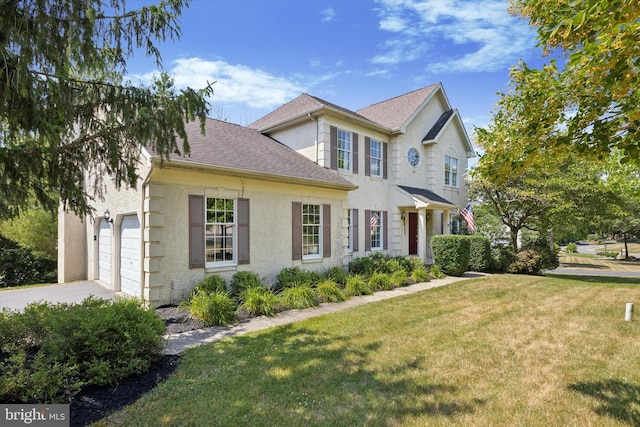 view of front of house featuring a garage and a front yard