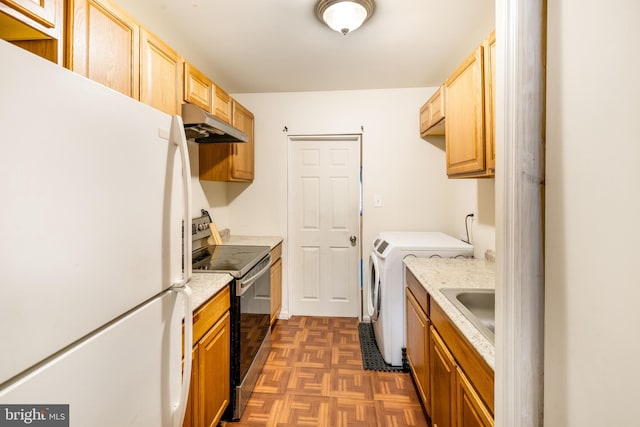 kitchen with electric range, freestanding refrigerator, light countertops, washer and dryer, and under cabinet range hood