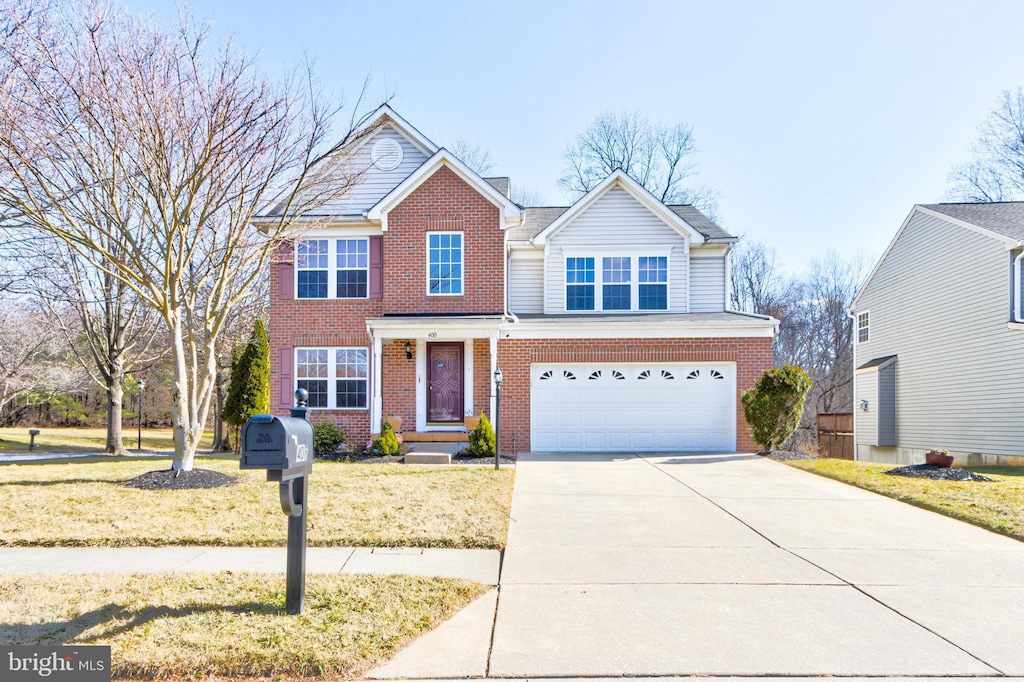 view of front property with a front lawn and a garage