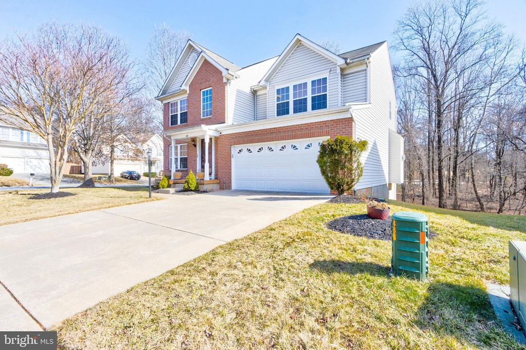 view of front of house featuring a front yard and a garage