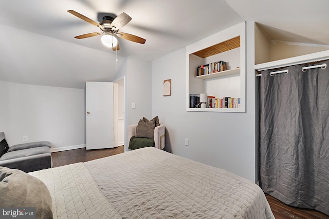 bedroom featuring ceiling fan, lofted ceiling, and dark hardwood / wood-style floors