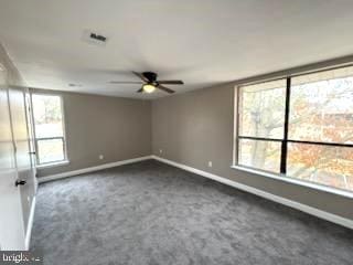 carpeted empty room featuring ceiling fan