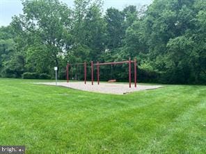 view of jungle gym with a lawn