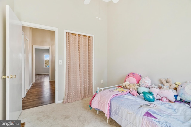 bedroom with baseboards, a ceiling fan, and carpet flooring