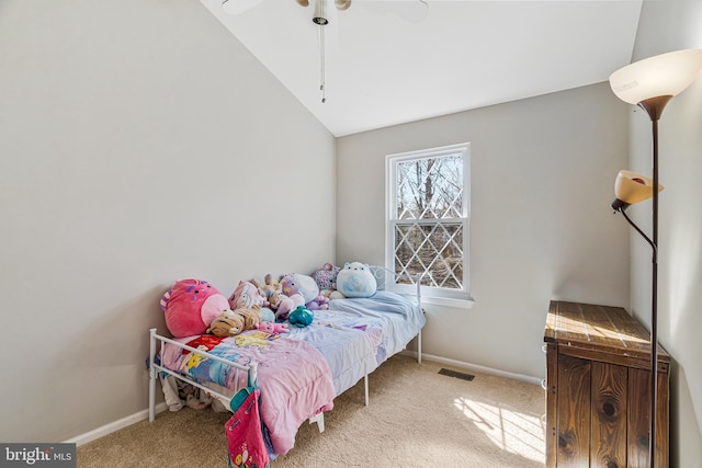 bedroom with baseboards, visible vents, carpet floors, and lofted ceiling