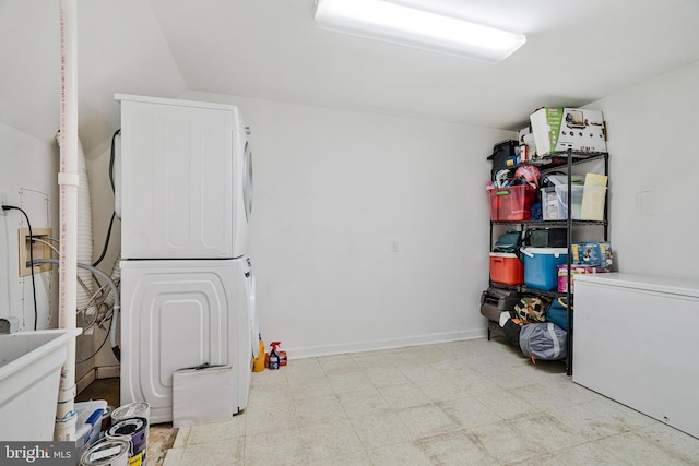 interior space with stacked washer and dryer