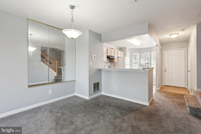 interior space with baseboards, stairs, and visible vents