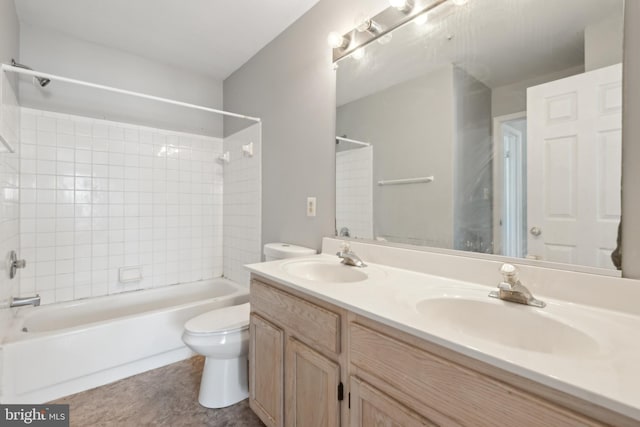 bathroom with toilet, double vanity,  shower combination, and a sink