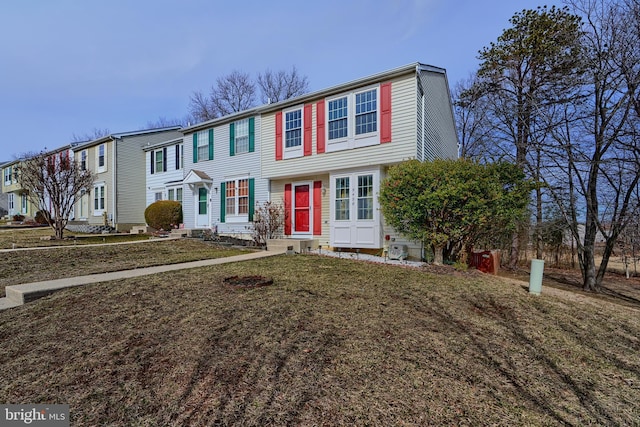 view of front of home featuring entry steps and a front lawn