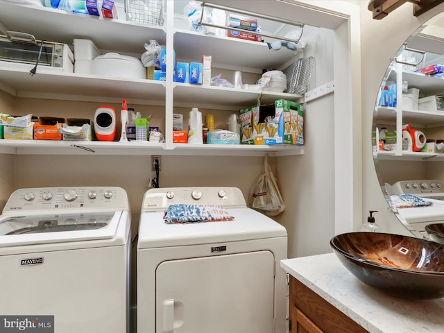 washroom featuring sink and washer and clothes dryer