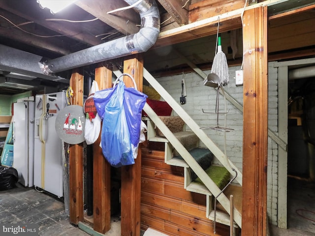 interior space with white refrigerator with ice dispenser and white refrigerator