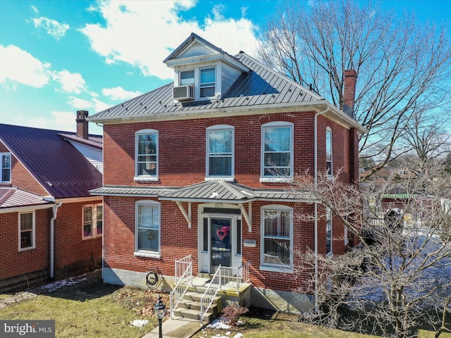 view of front of house featuring cooling unit