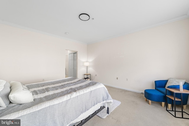 bedroom featuring baseboards, carpet floors, and crown molding