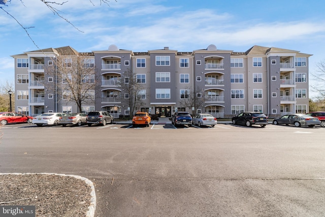 view of property featuring uncovered parking