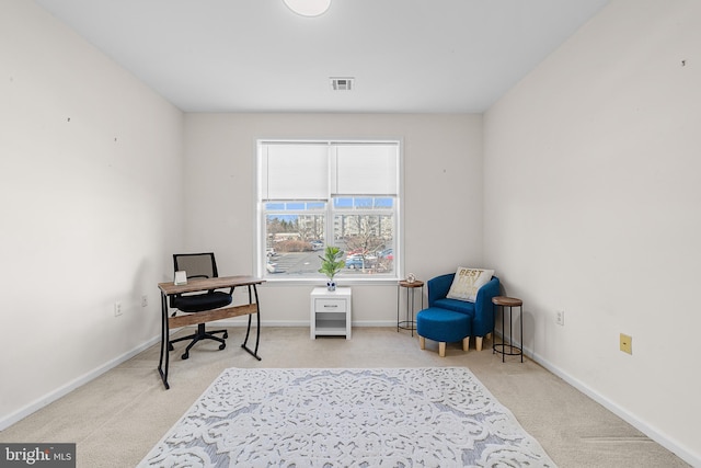 sitting room with carpet flooring, visible vents, and baseboards